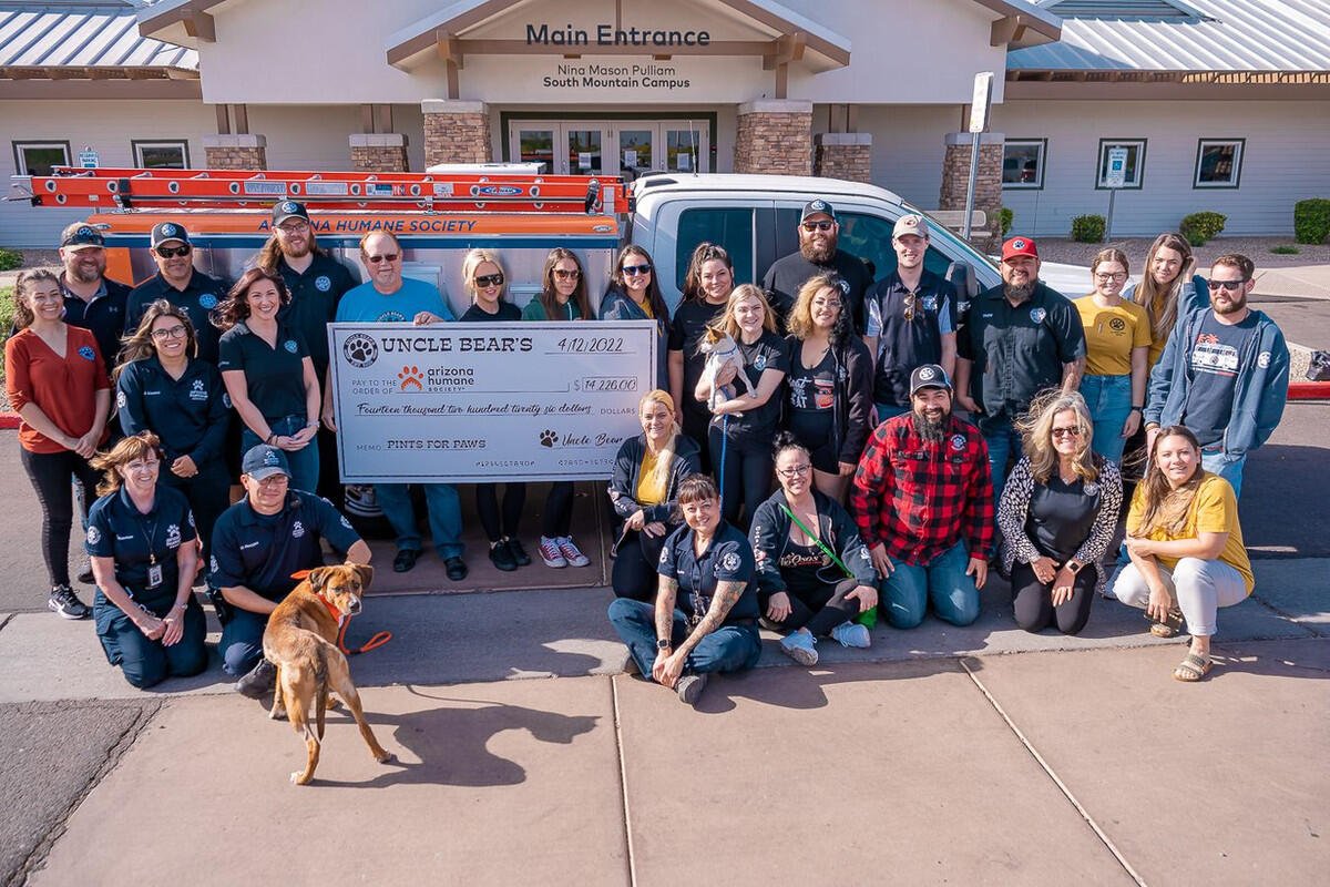 Dogs and their people at a Pints for Paws event, Uncle Bear's Mesa — Greenfield