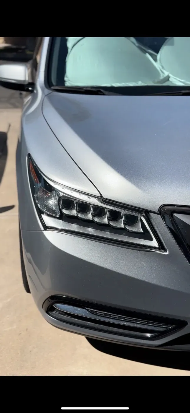 Same Acura after paint correction with glossy paint and clear headlight