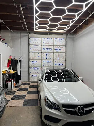 White Mercedes SUV detailed under the studio lights