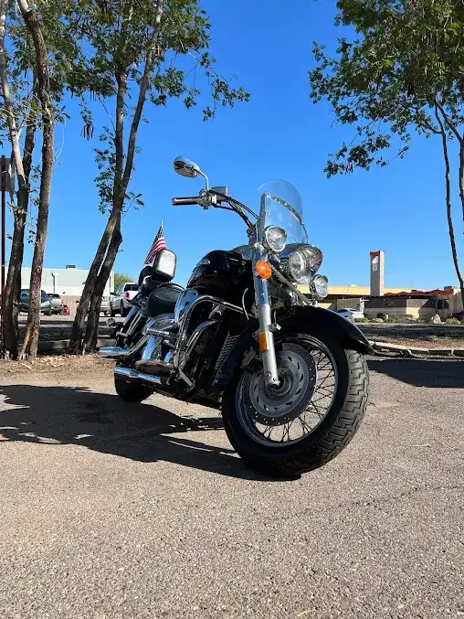 Black cruiser motorcycle with polished chrome